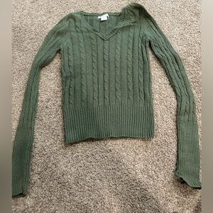green v-neck sweater